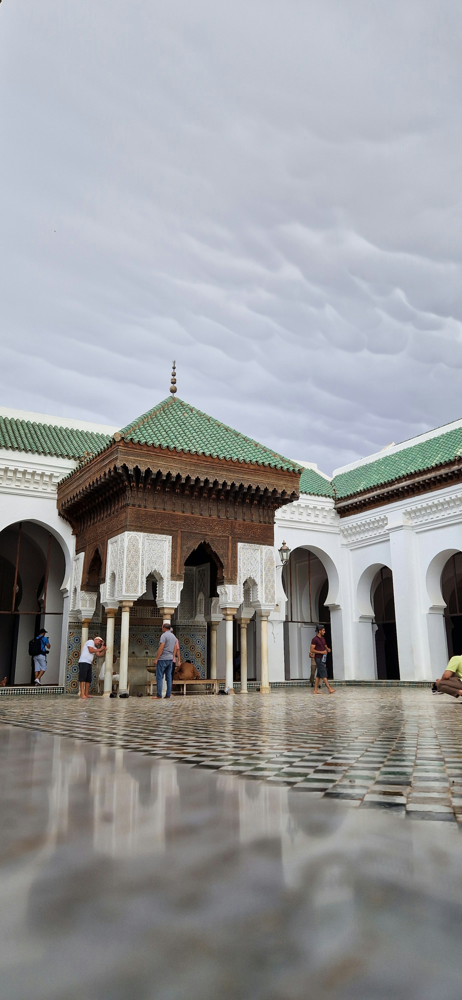 A group of people standing outside of a building