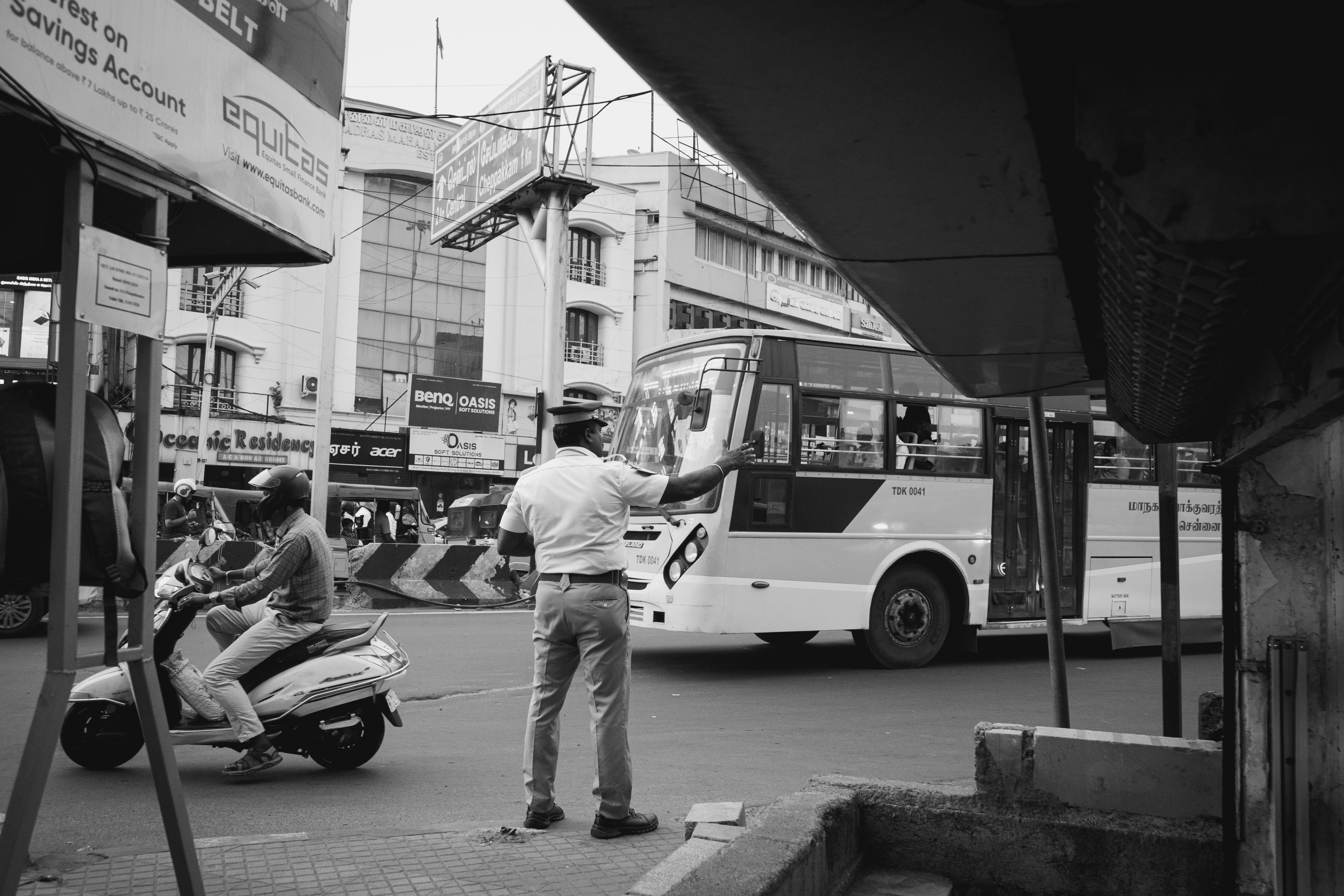 A black and white photo of a man playing a guitar