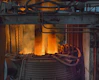 A large metal object with a lot of fire coming out of it
