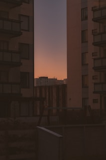 A tall building with a sky in the background