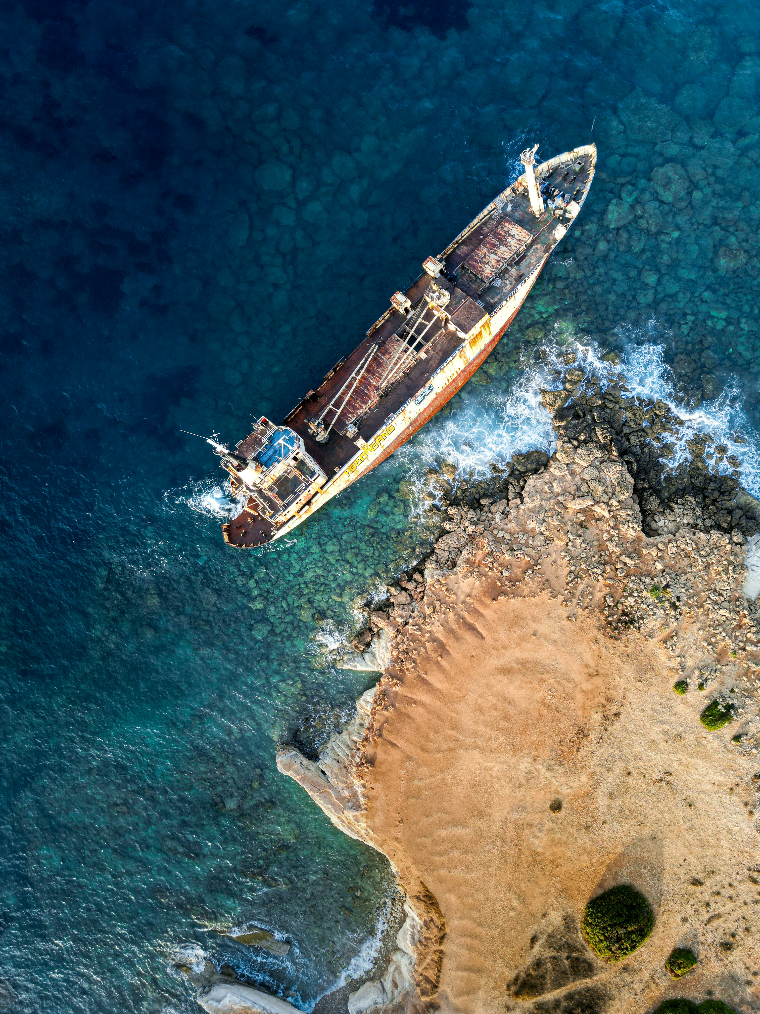 An aerial view of a boat in the ocean