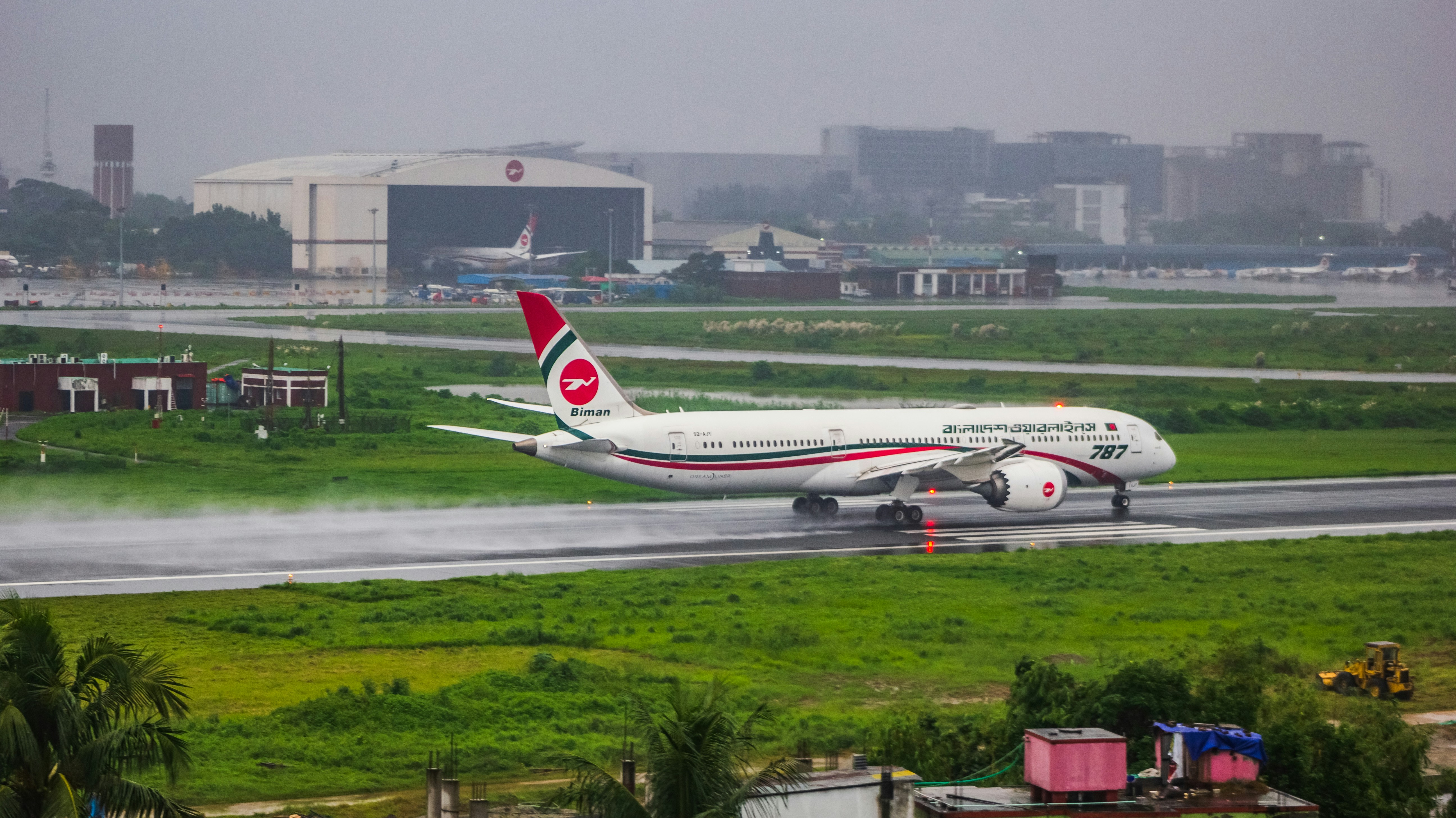 A large jetliner sitting on top of an airport runway