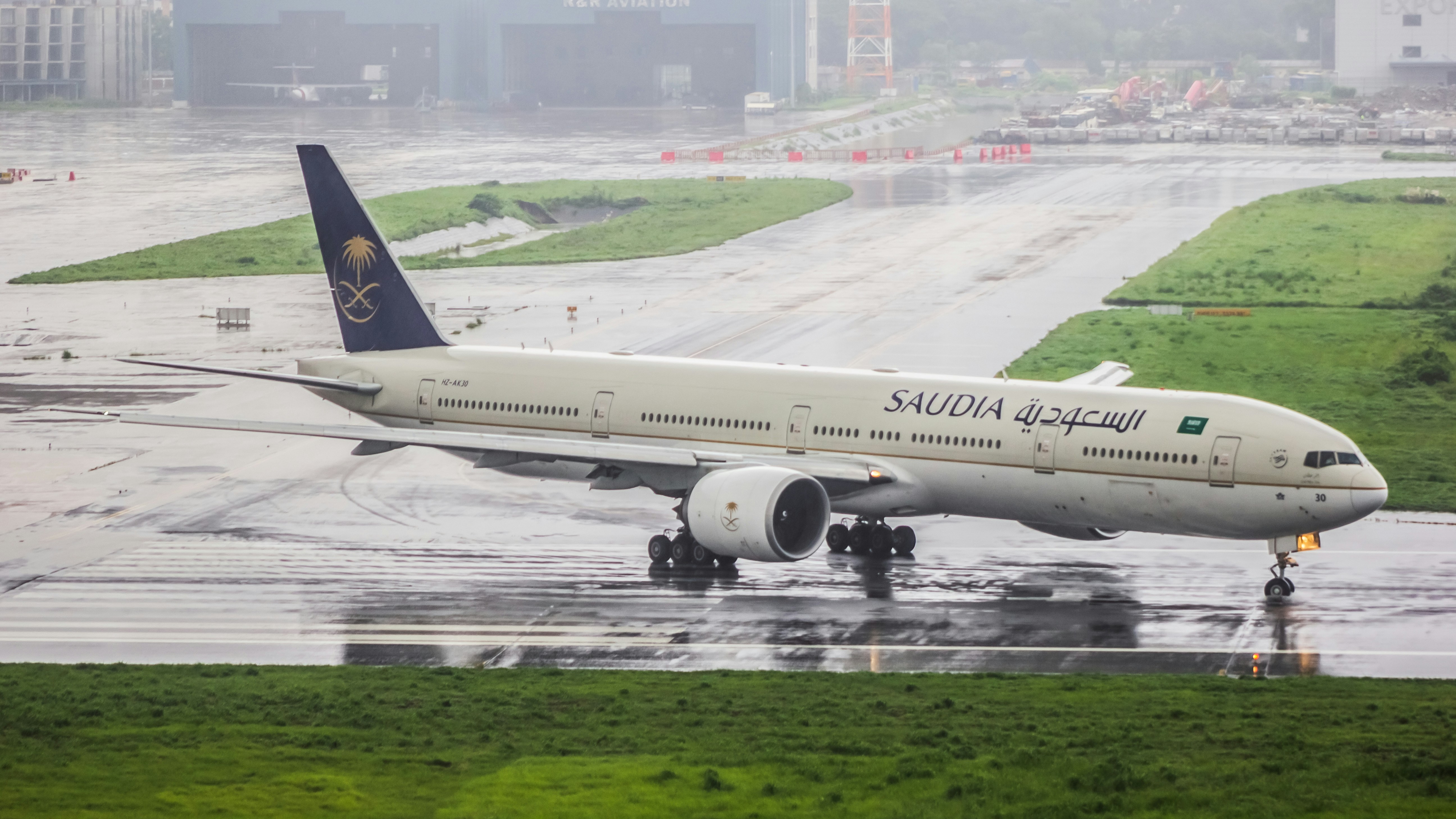 A large jetliner sitting on top of an airport runway