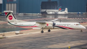 A small airplane is taking off from the runway