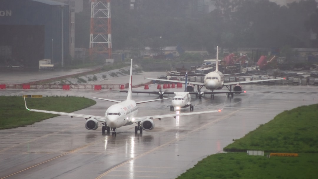 A couple of airplanes that are on a runway,