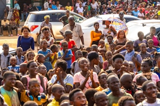 A large group of people standing in front of a crowd