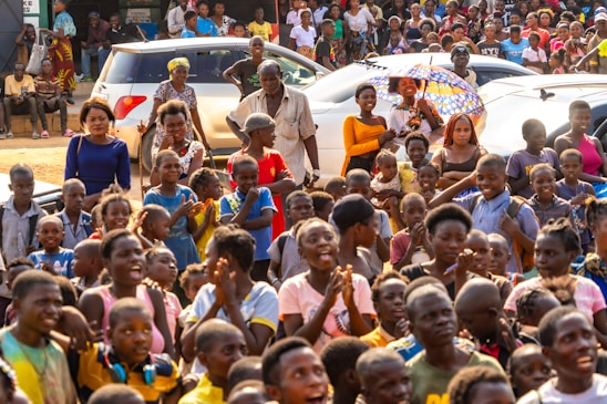 A large group of people standing in front of a crowd