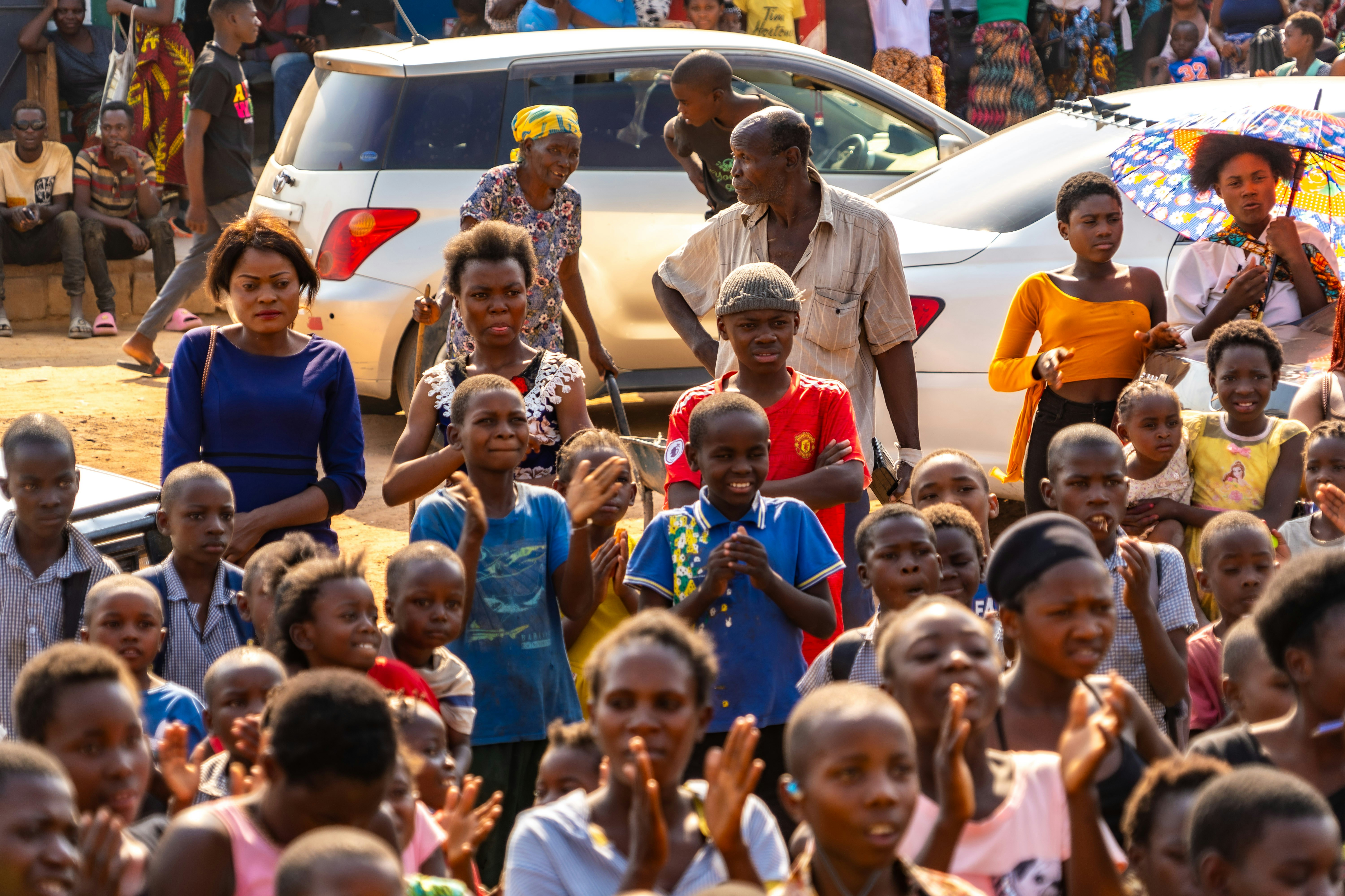 A group of people standing in front of a crowd