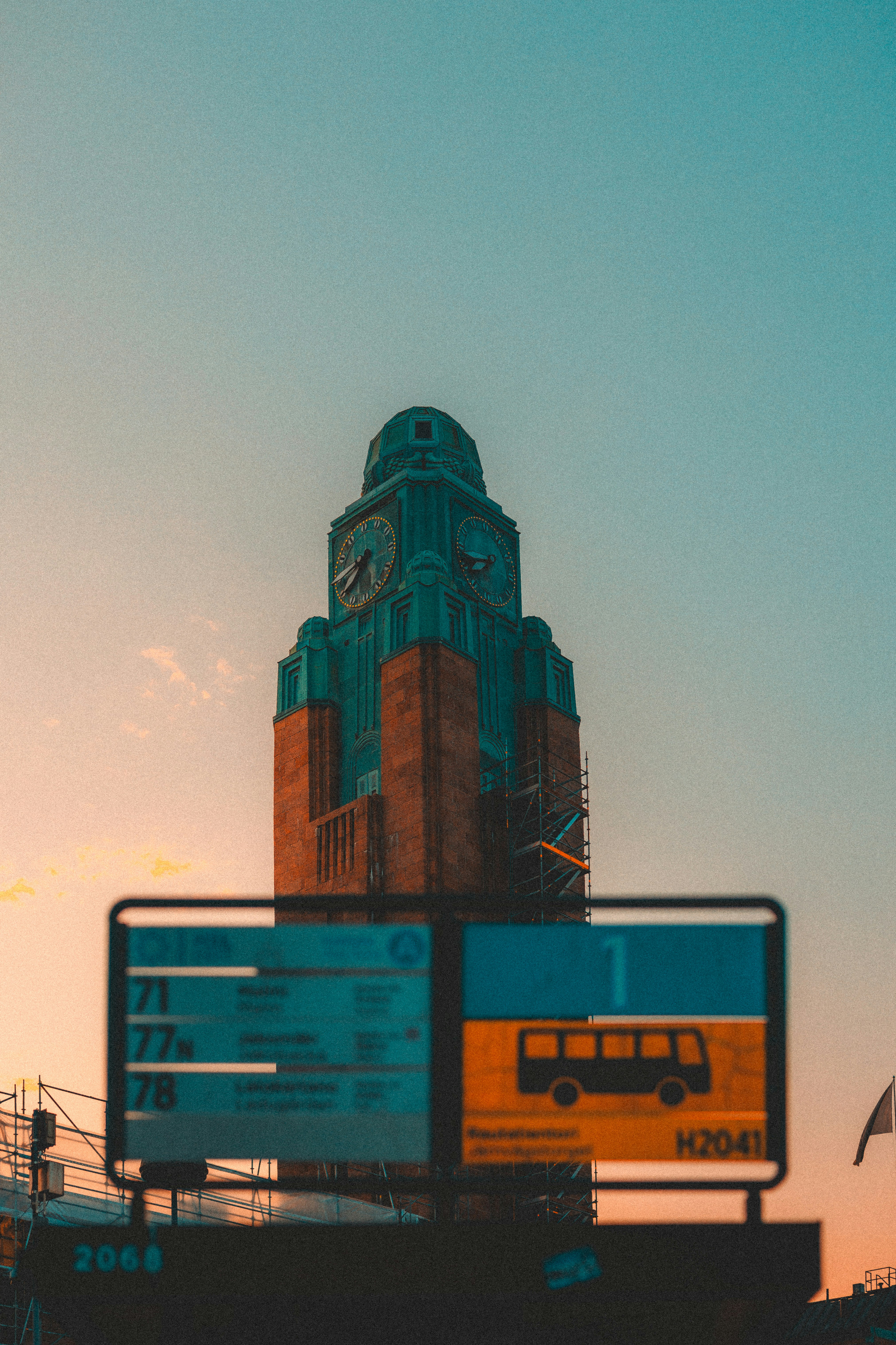 A large clock tower towering over a city photo – Free Urban Image on ...