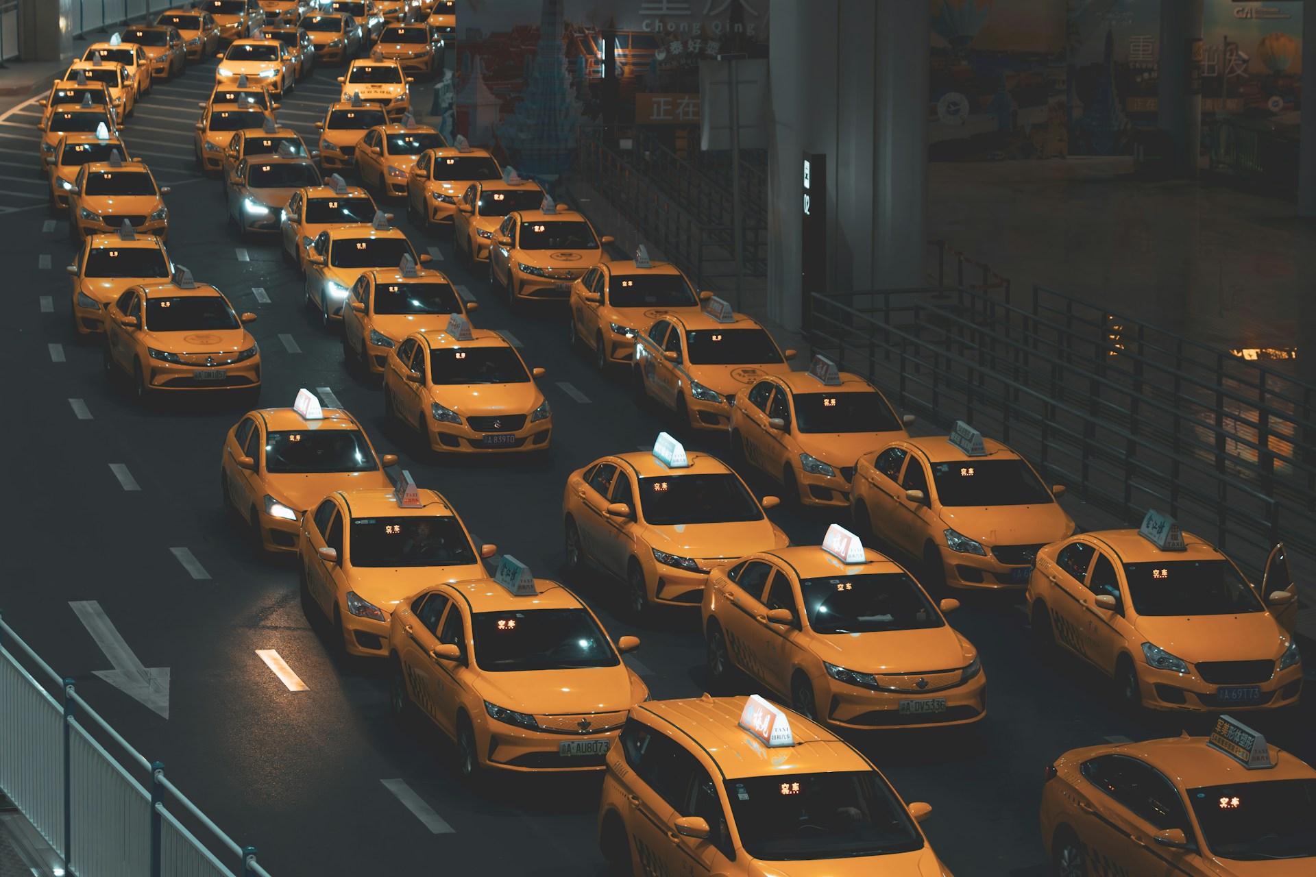 A large number of taxi cabs on a highway