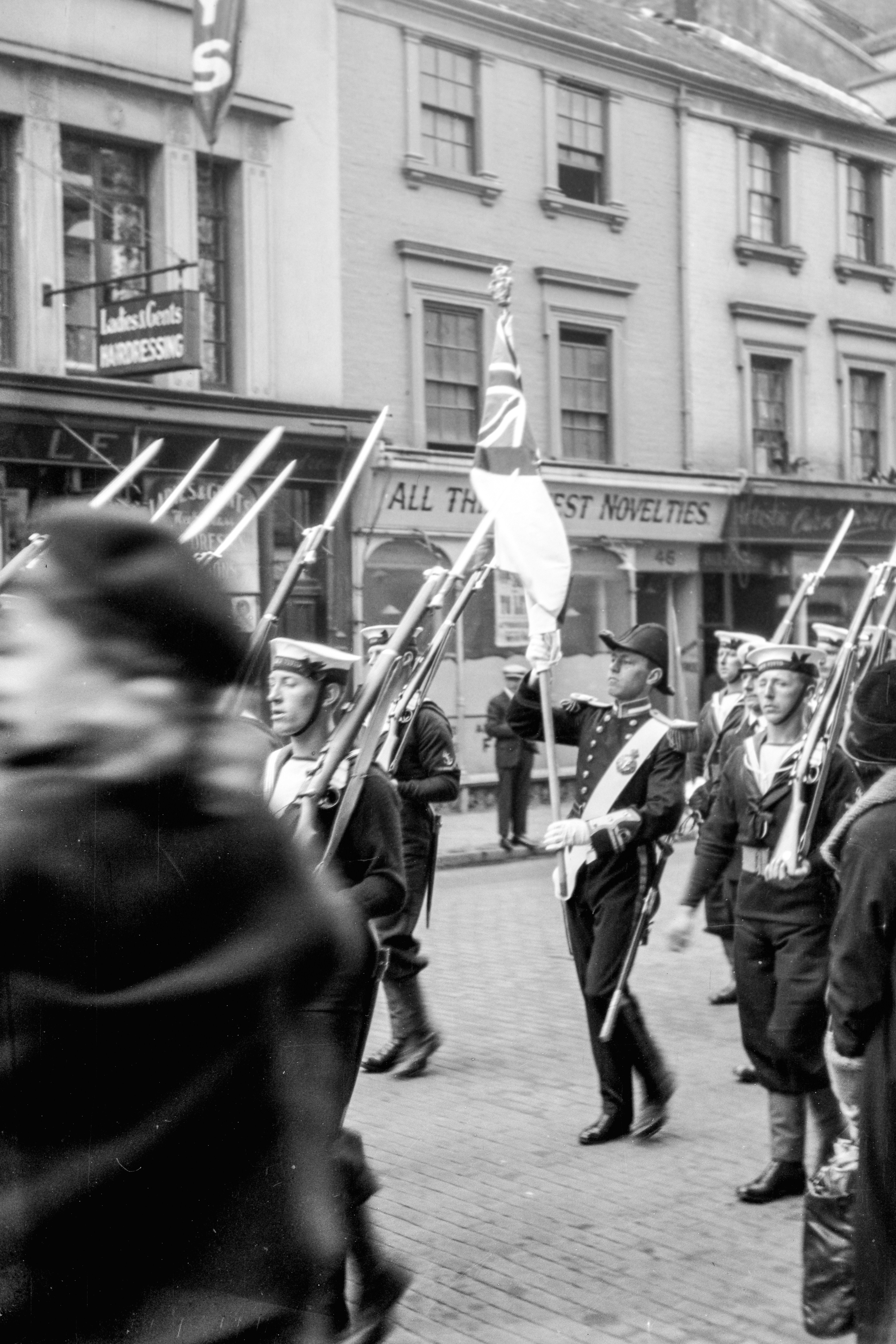 A group of people marching down a street