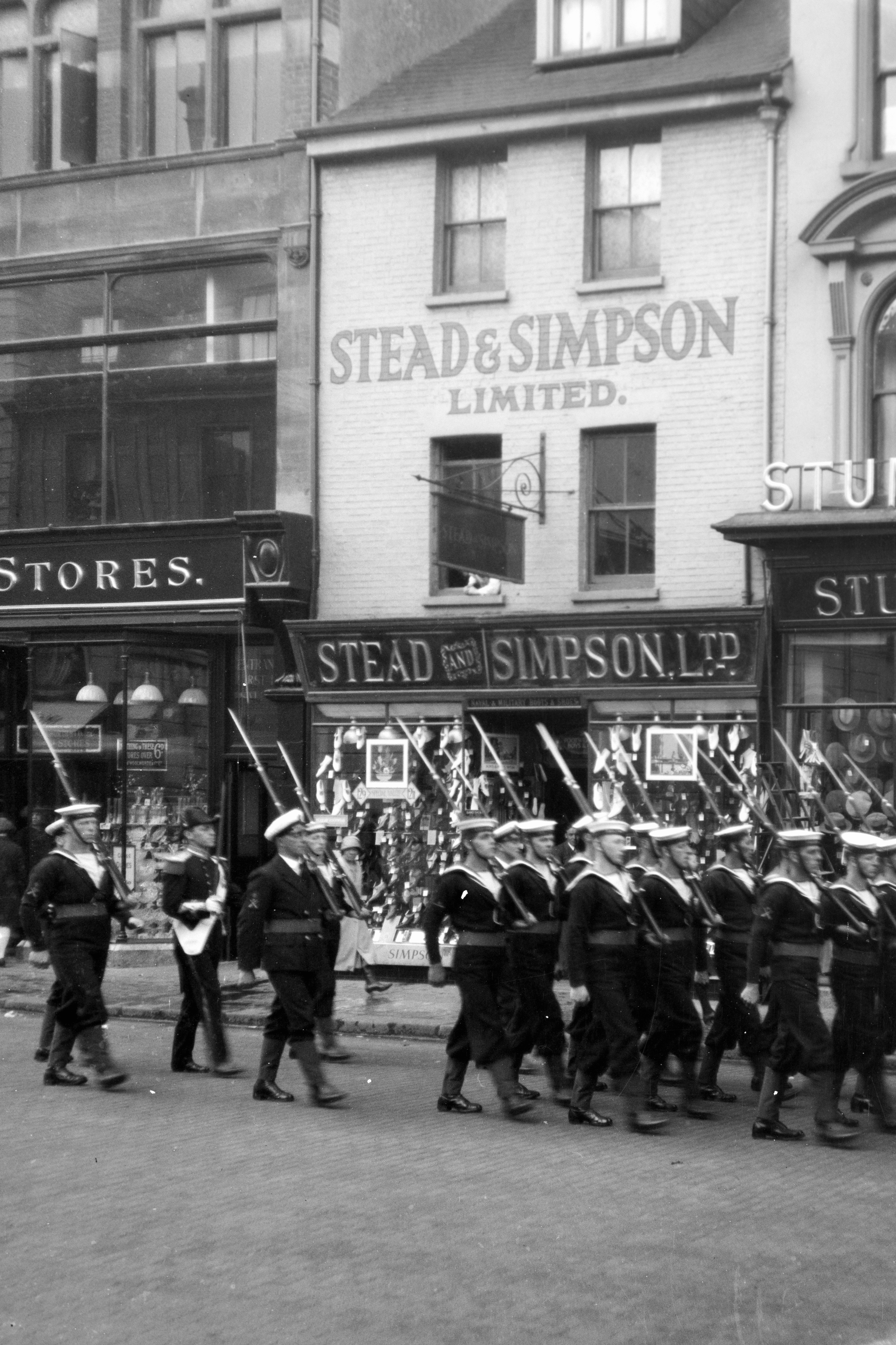 A group of people marching down a street