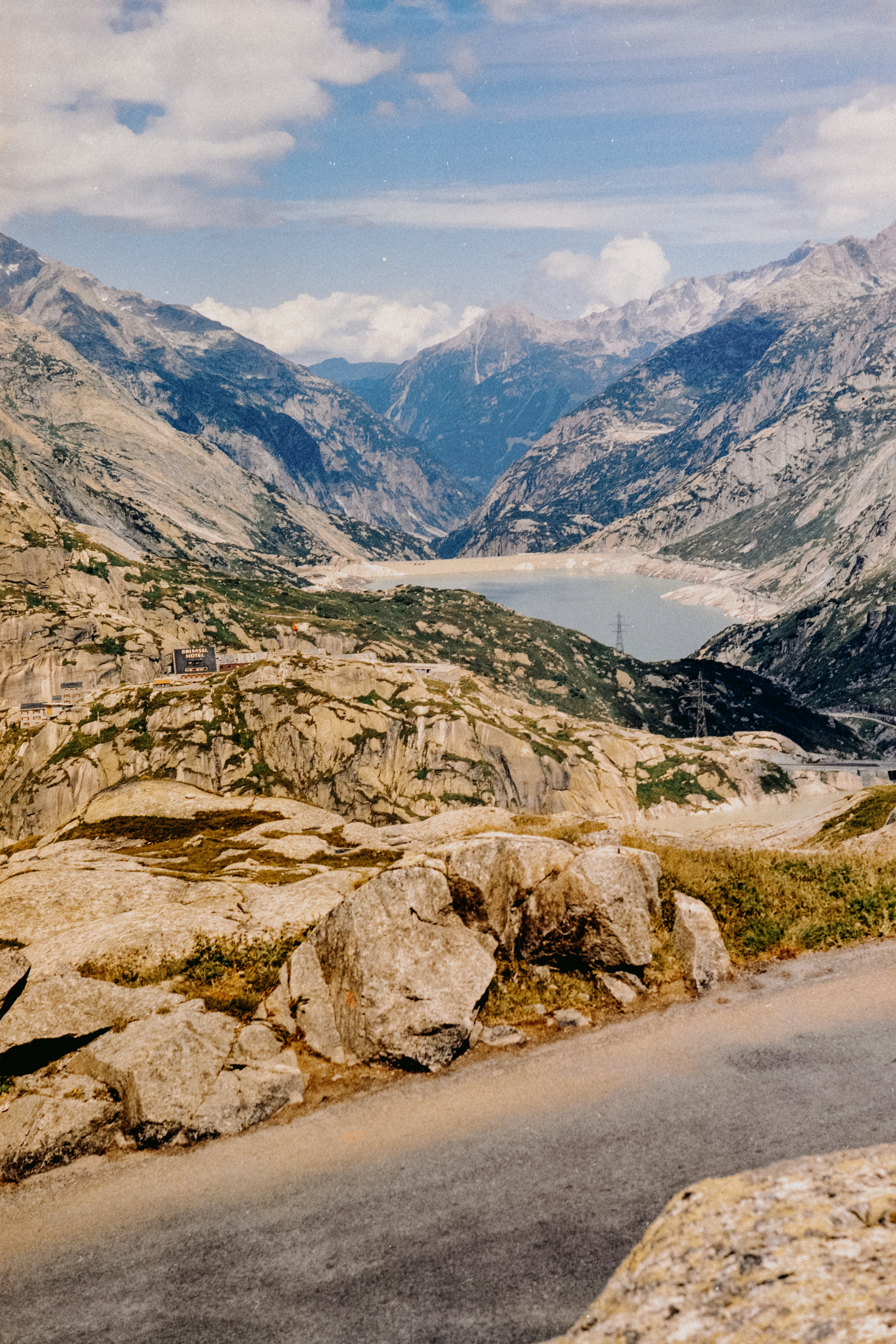 A view of a mountain range with a body of water in the distance