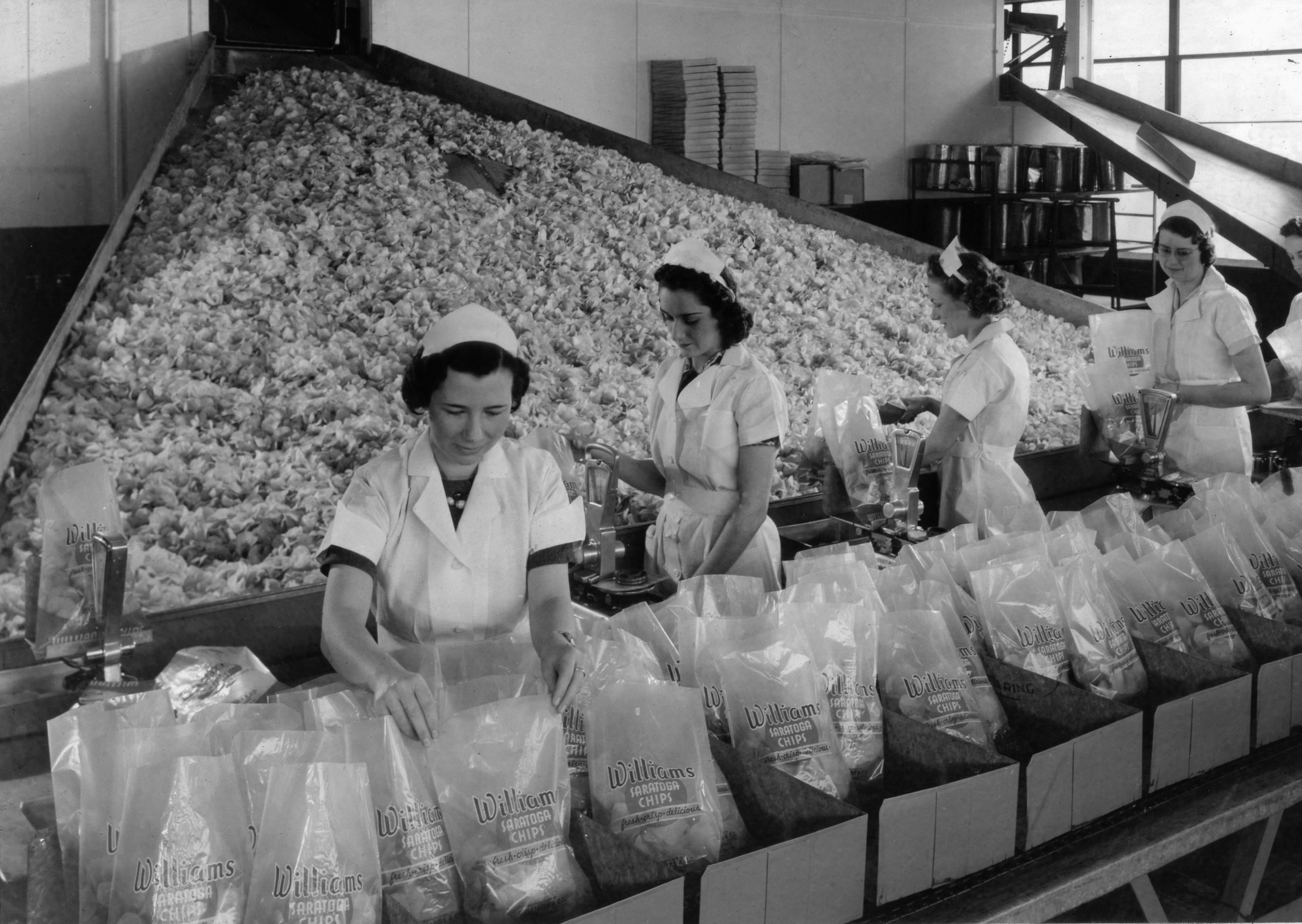 Women packaging goods in a factory