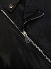 A close up of a black leather jacket