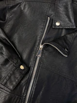 A black leather jacket with a zipper on the back