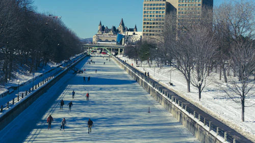 Winter view of the frozen Rideau Canal skateway running through downtown Ottawa