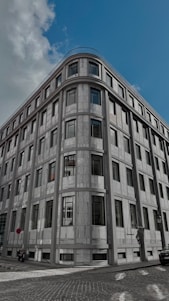 A very tall building sitting on the side of a road