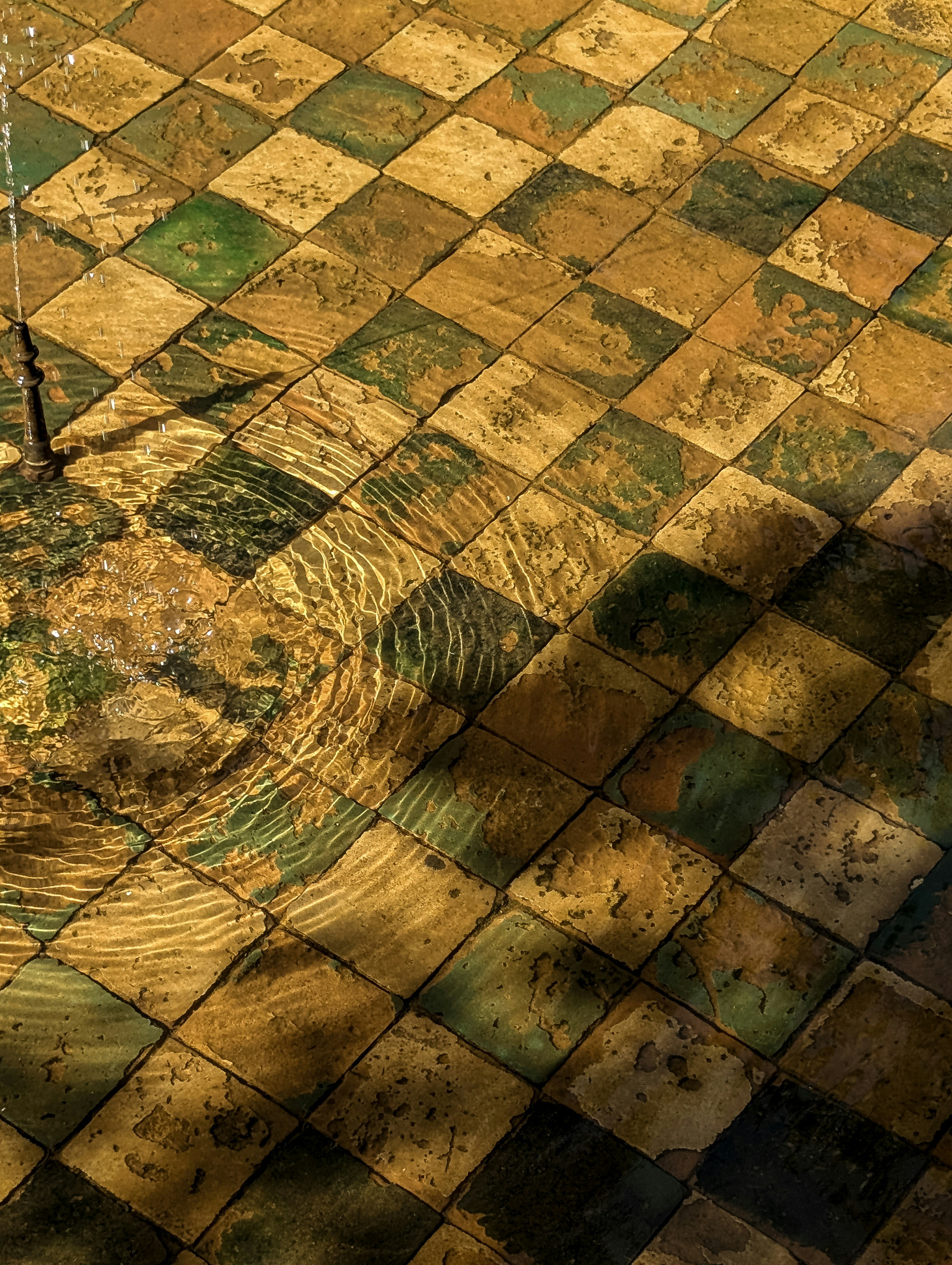 A clock that is sitting in the middle of a floor