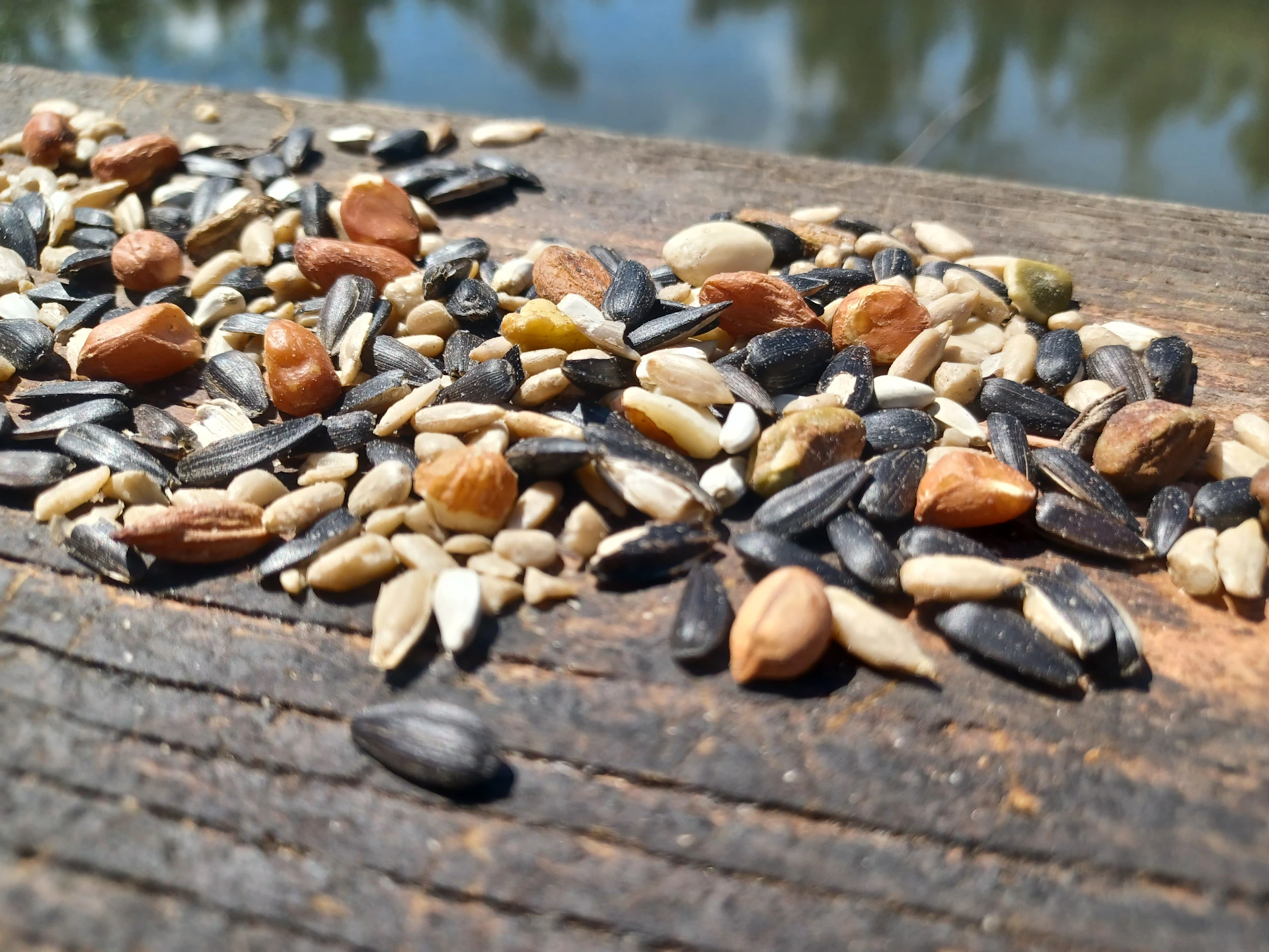 A pile of nuts sitting on top of a wooden table