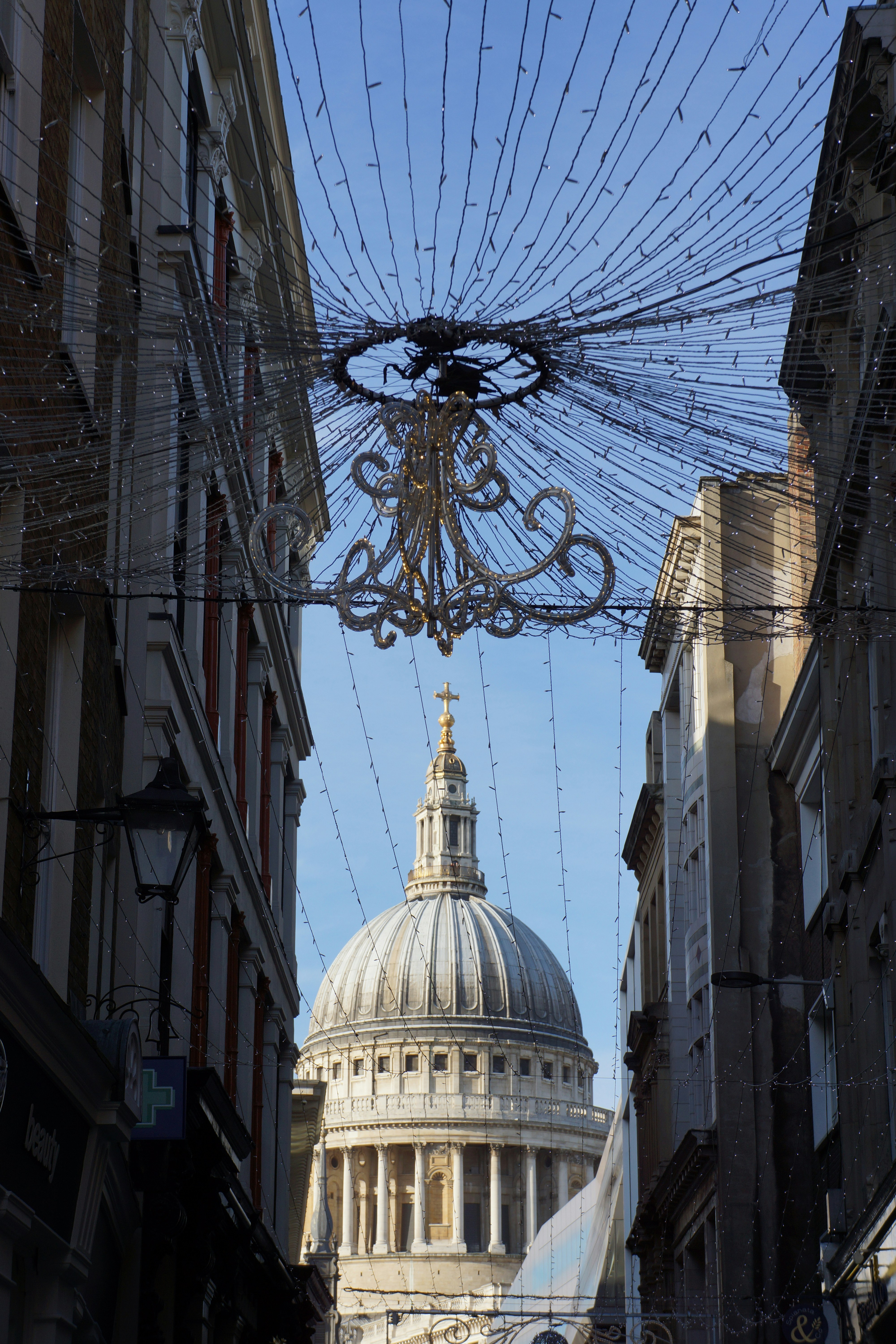 A building with a dome and a chandelier in the middle of the street