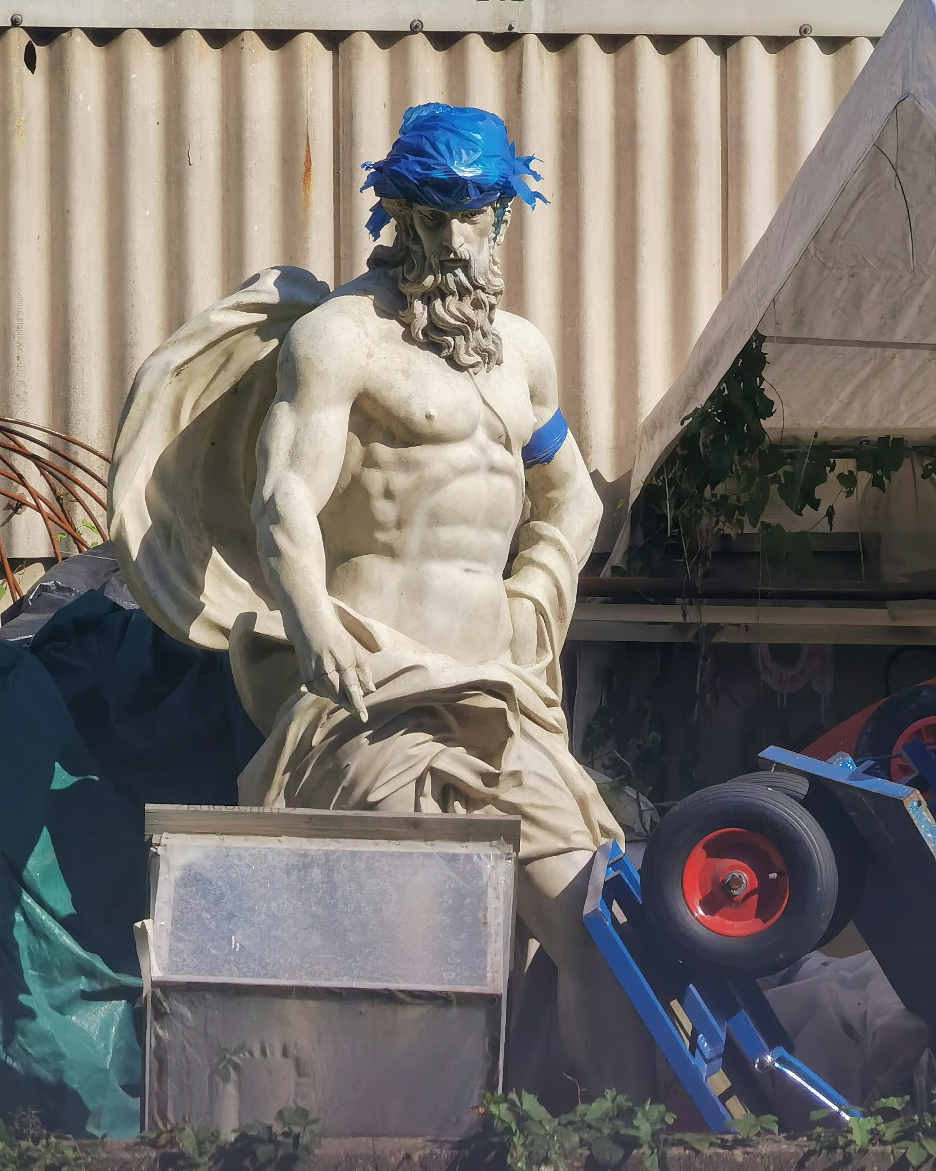 A statue of a man with a blue turban