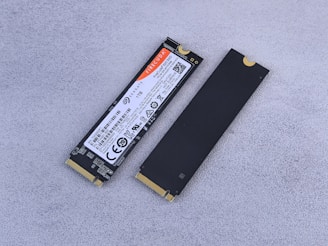 A laptop battery sitting on top of a white surface