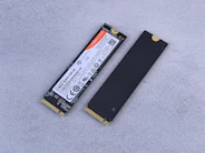 A laptop battery sitting on top of a white surface