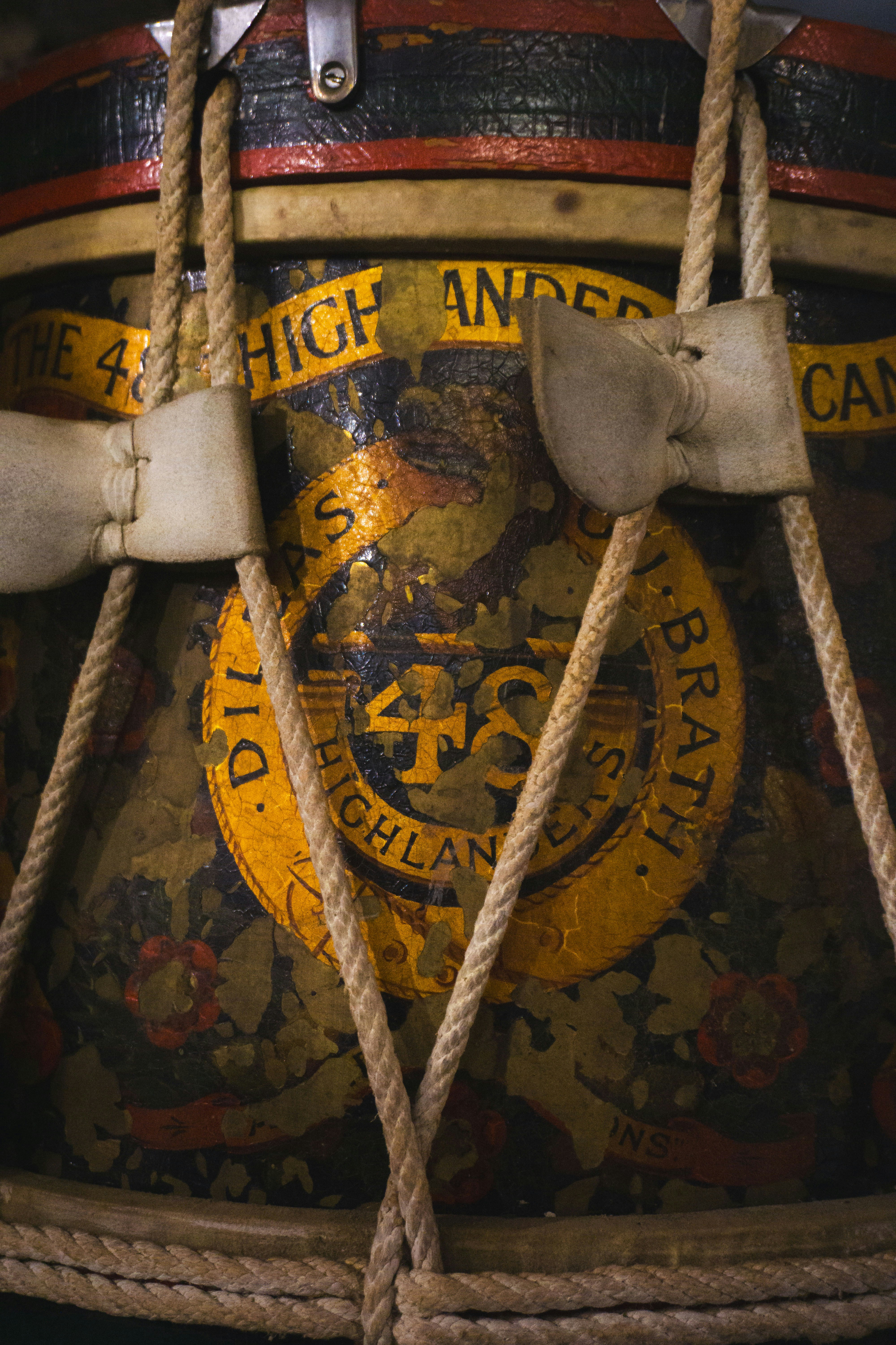 A close up of a drum with rope around it