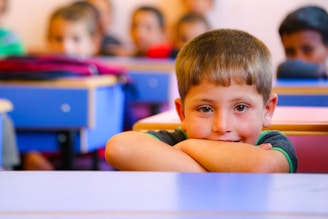 A group of children sitting at desks in a classroom