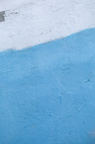 A man riding a skateboard down the side of a wall