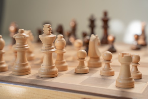 A close up of a chess board with pieces on it
