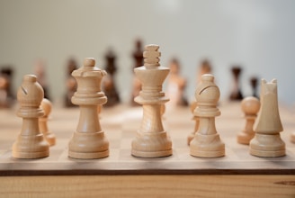 A close up of a chess board with pieces on it