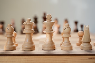 A close up of a chess board with pieces on it