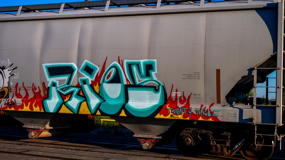 A train with graffiti on the side of it,
