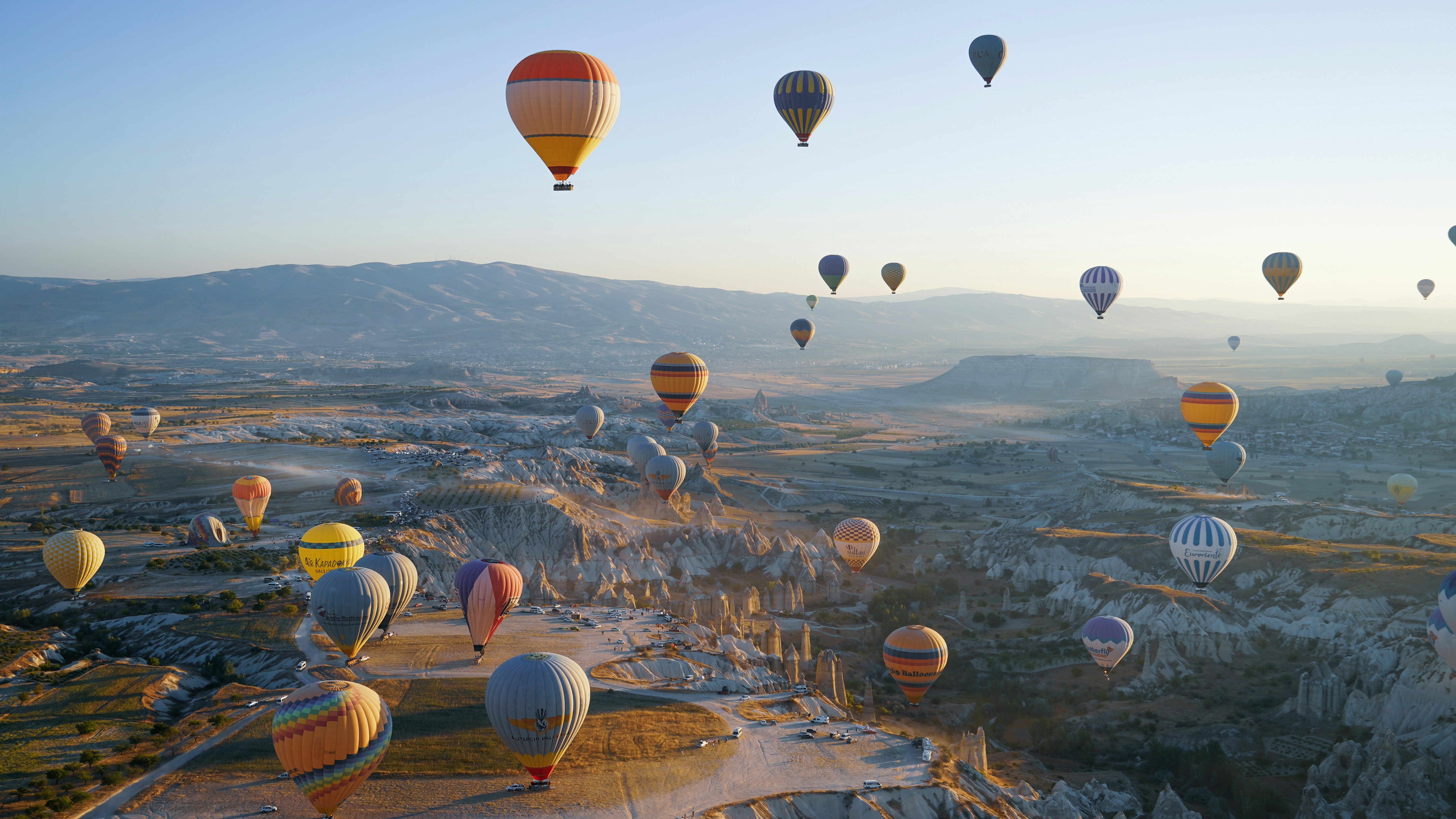 A bunch of hot air balloons flying in the sky photo – Free Colourful ...