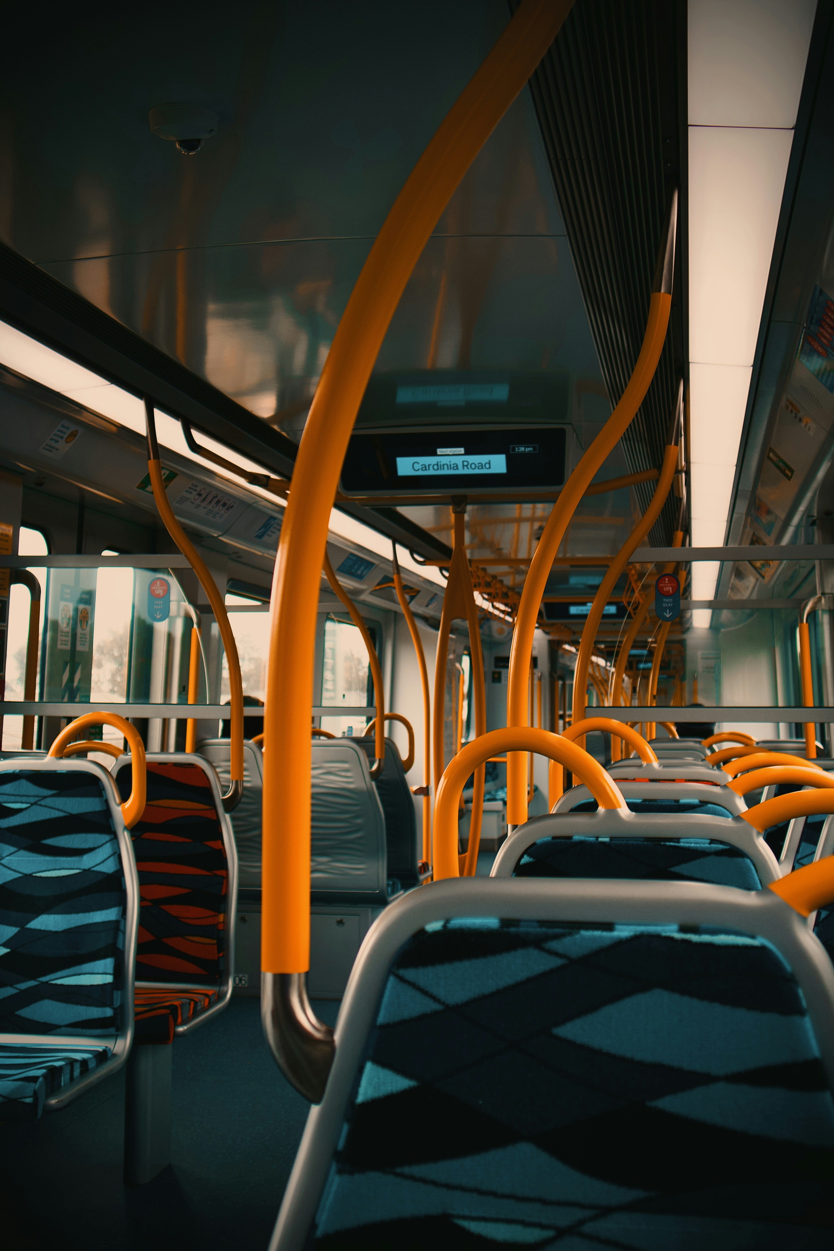 The interior of a public transit bus with empty seats