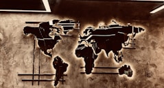 A picture of a world map on a wall