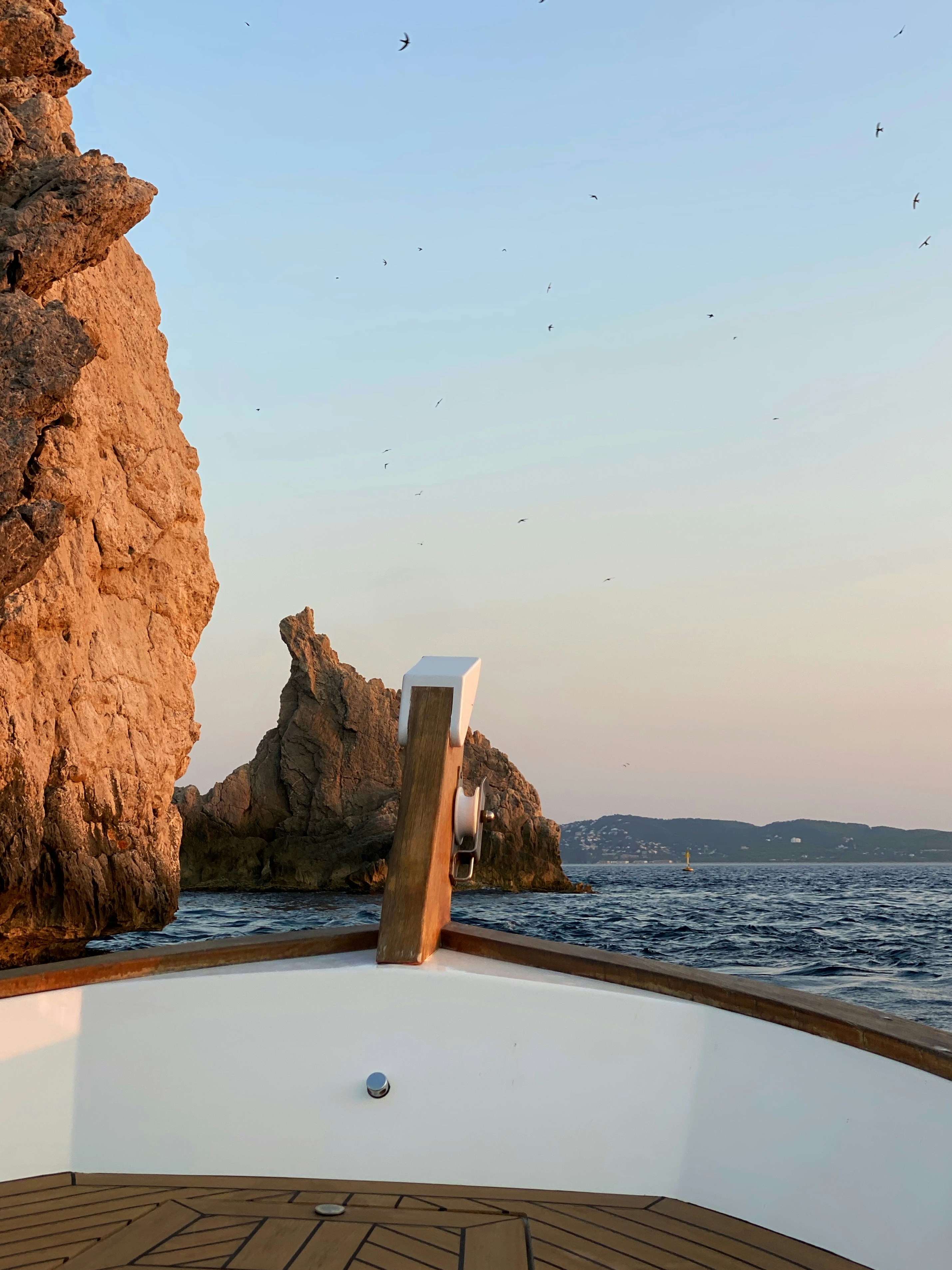 A view of a rock outcropping from a boat