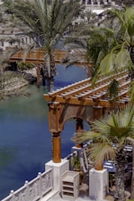 A view of a river with a bridge in the background