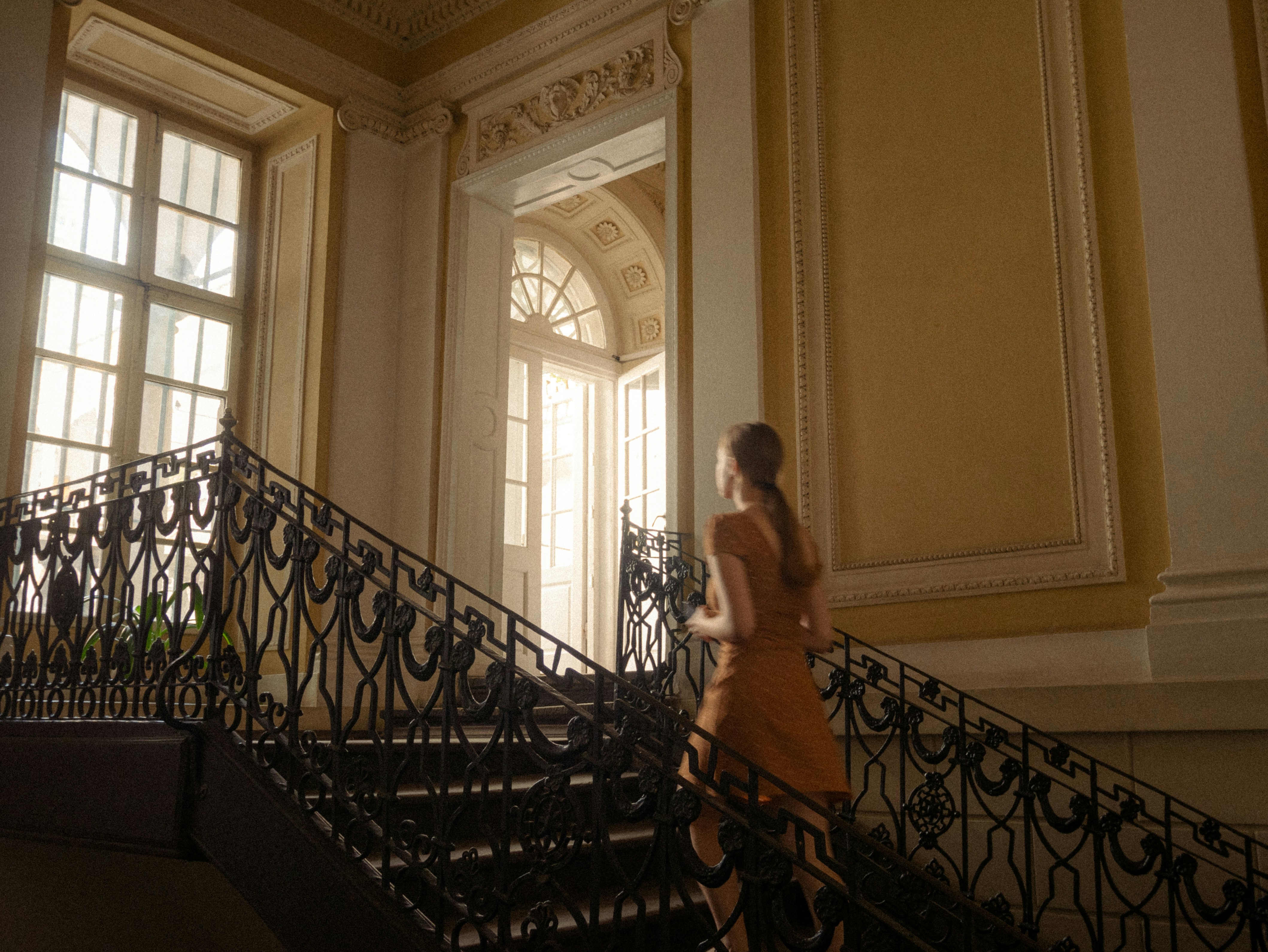 A woman walking down a set of stairs