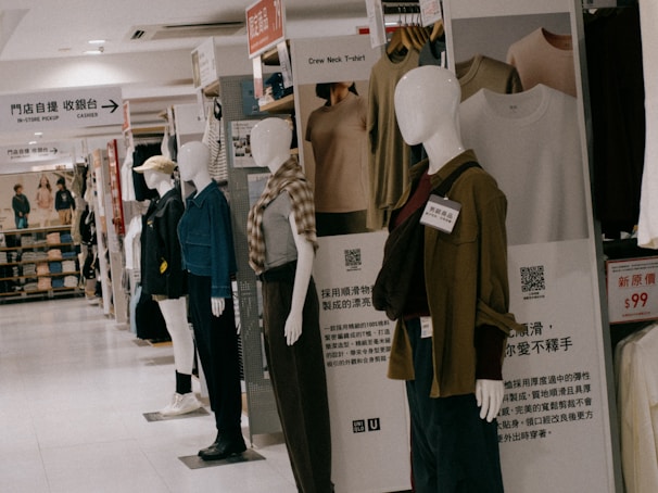 A group of mannequins are standing in a store