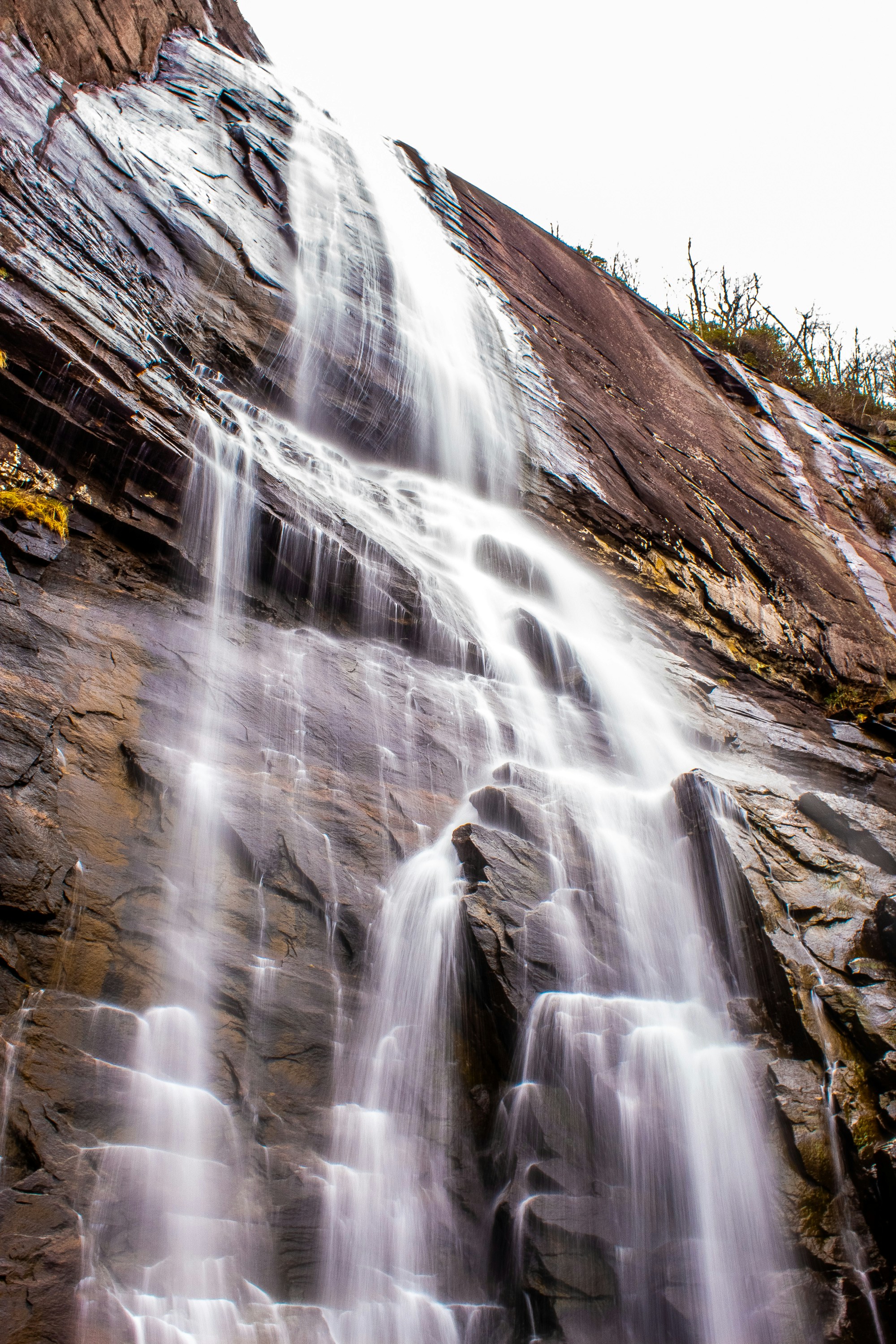 A large waterfall with lots of water coming out of it