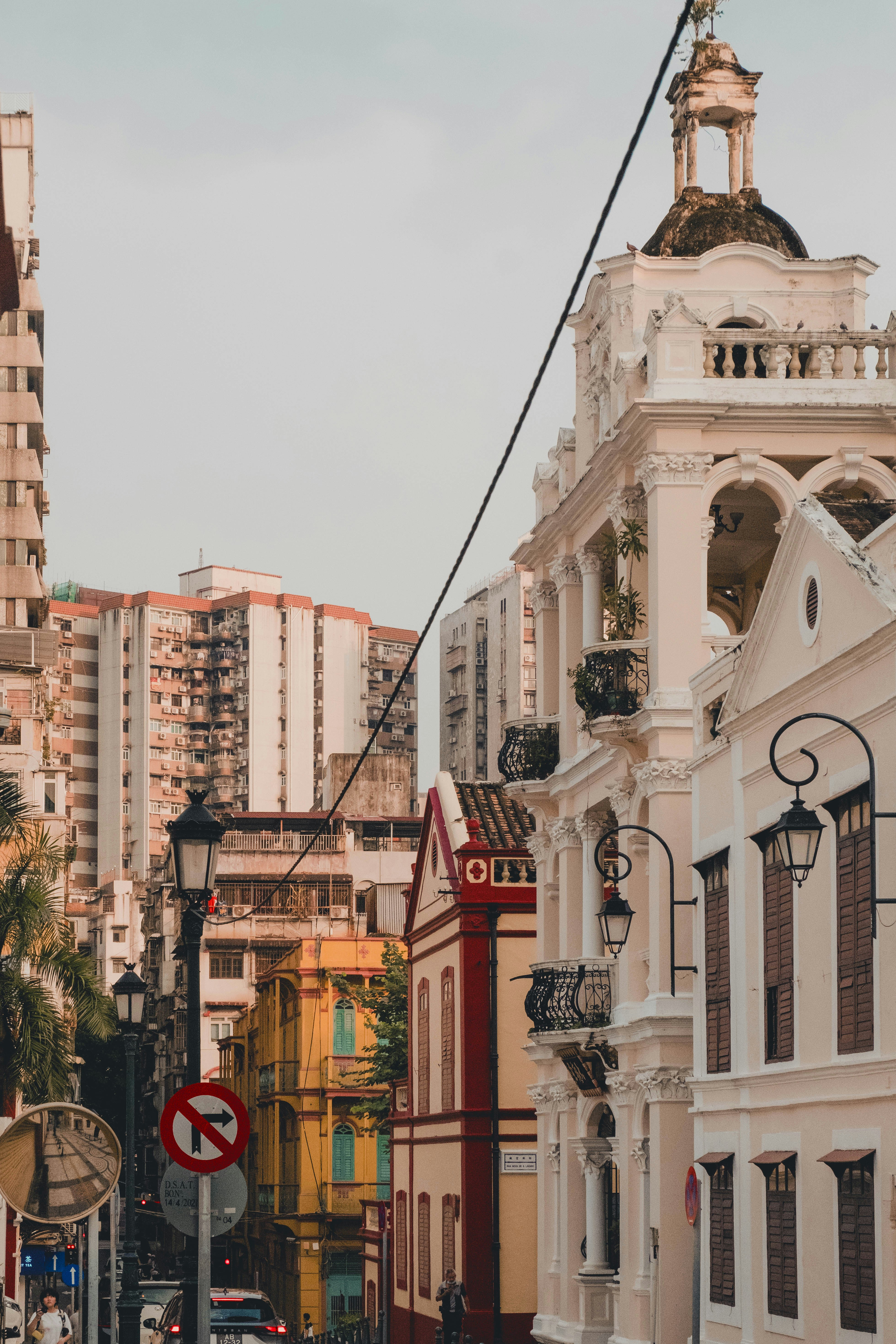 A city street filled with lots of tall buildings