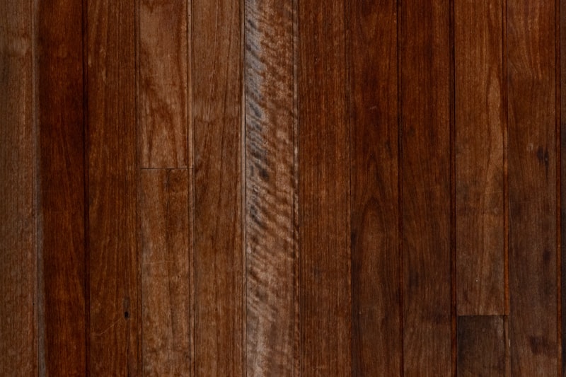 Brushbox timber flooring close-up showing reddish-brown grain
