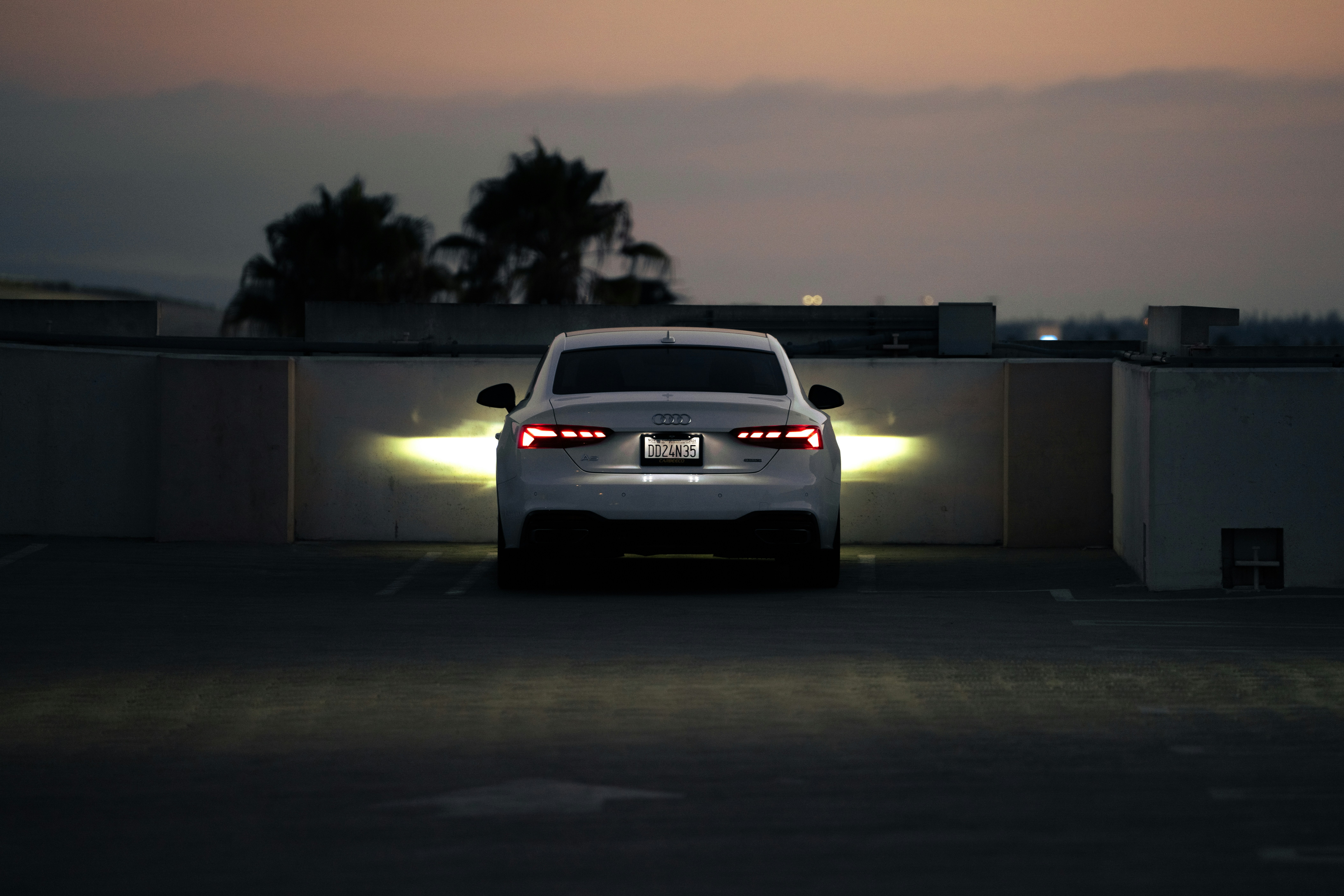 Luxury white Audi at dusk