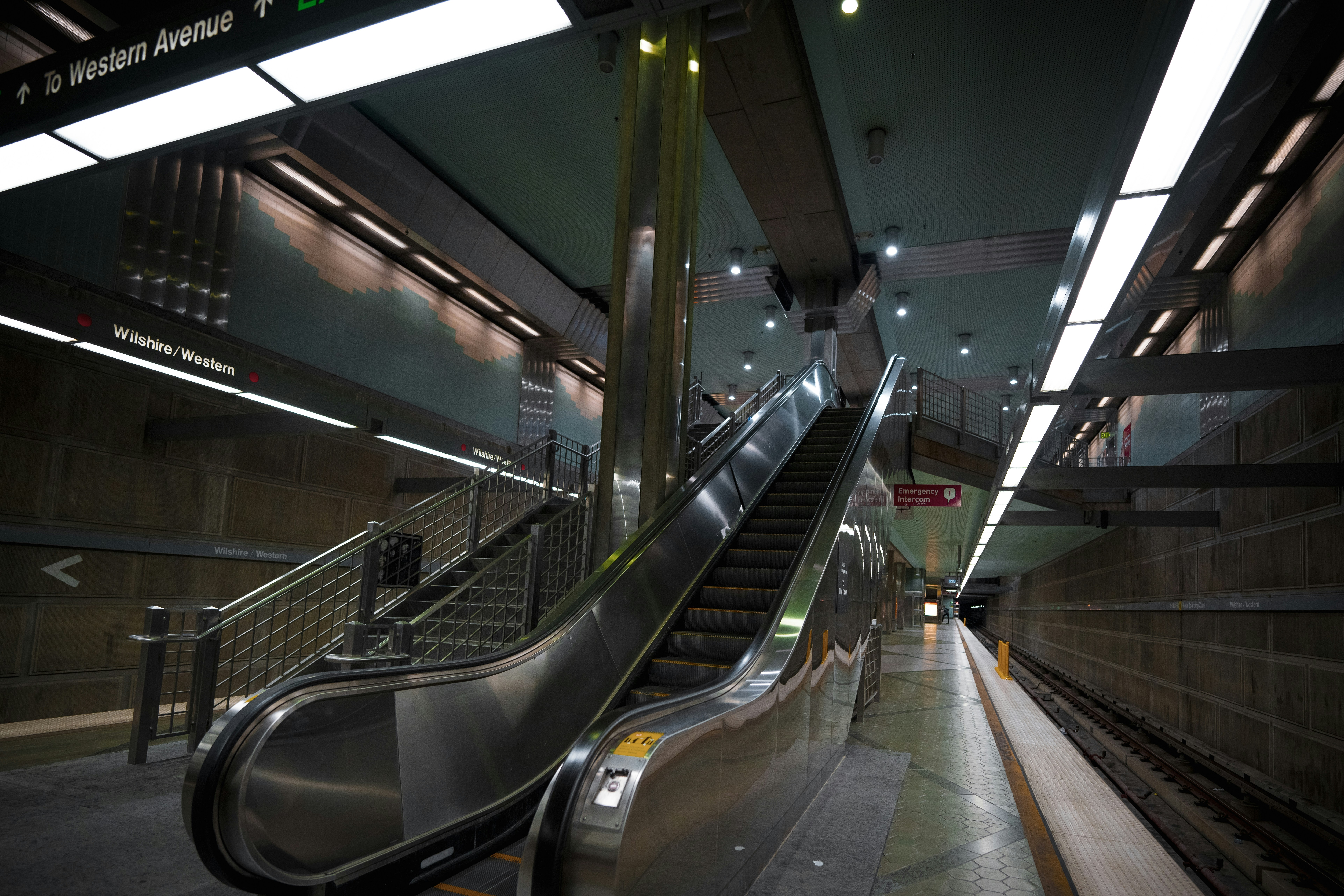 An escalator in a subway station at night