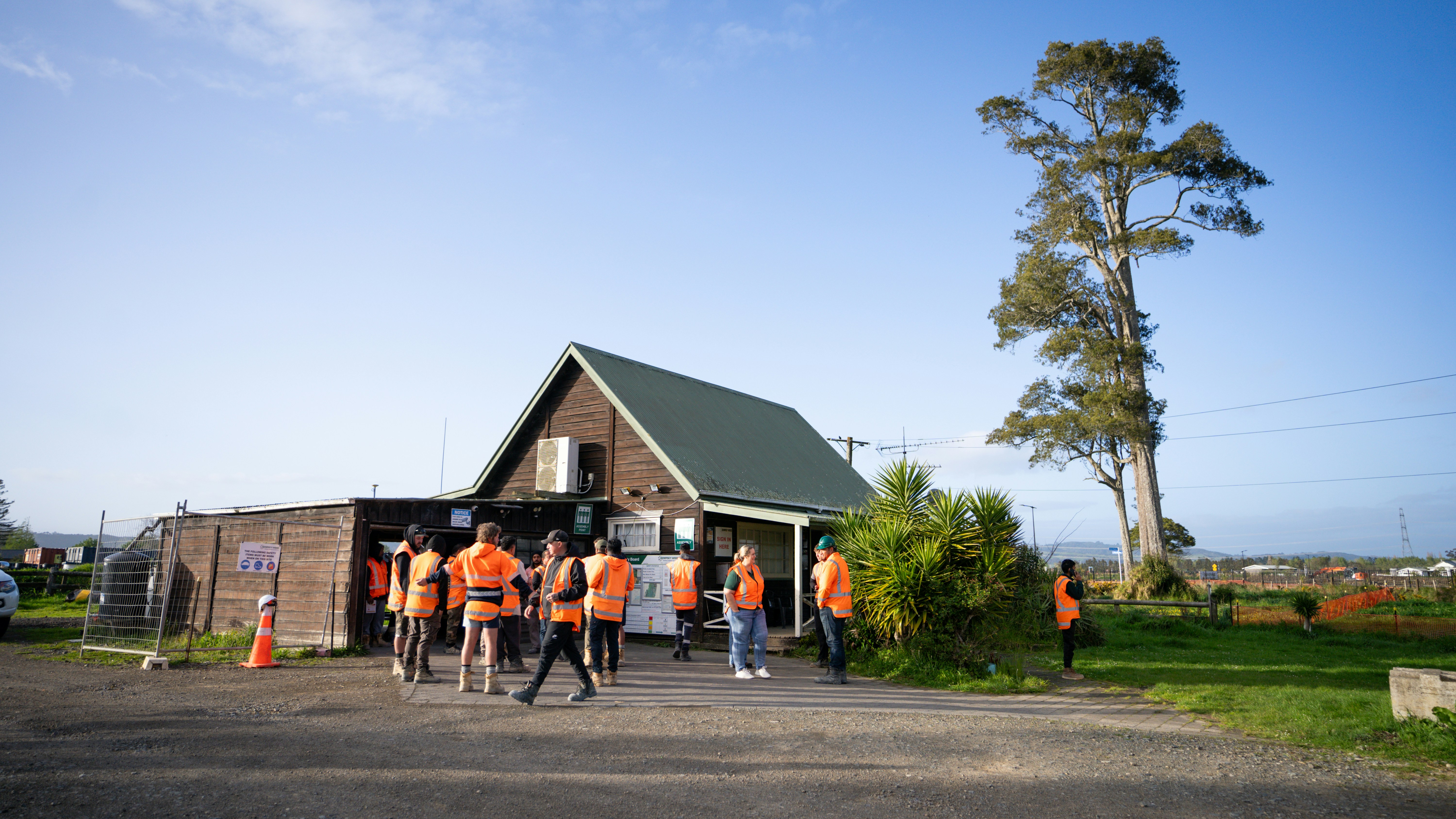 A group of people standing in front of a building