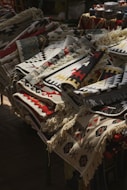 A table topped with lots of blankets and rugs