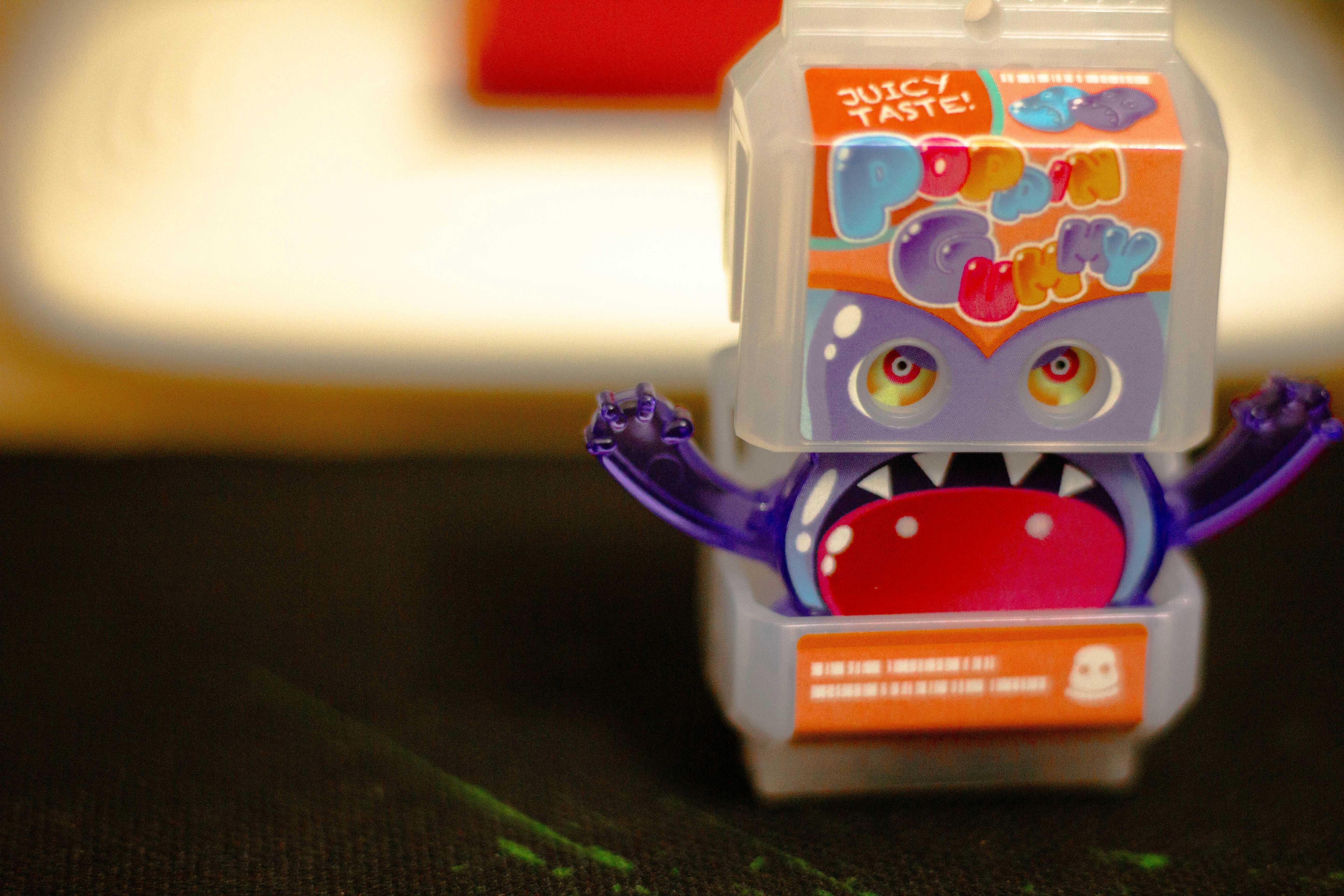 A plastic toy with a mouth open on a table